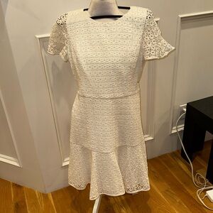 White textures dress with cap sleeves and a flare on the skirt